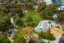 A series of urban rooms are organized around the main circular promenade which surrounds the central civic green.