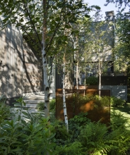 Different mixes of plants and bulbs were selected based on the varying light conditions and to provide seasonal interest.