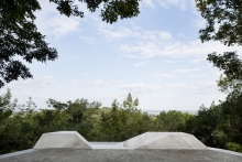Landscaped halt with close-up of granite bench