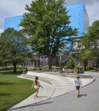 Interactive water jets and sculptural terraced seating work together to create an animated place to gather.