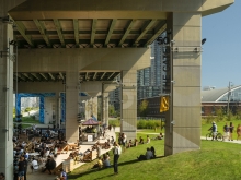 Strachan Gate allows visitors to descend into a green amphitheatre and event space.  Image Credit Nic Lehoux