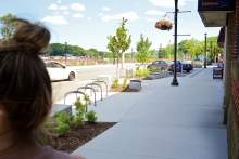Widened sidewalks and bump-outs provide space for trees and seating in a new pedestrian-oriented environment