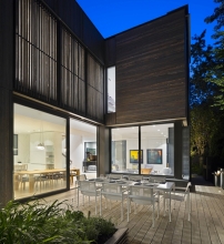 The side garden dining terrace at night.