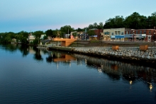 The view from the Old Bridge at dusk with Pijinuiskaq Park as the foreground to King Street